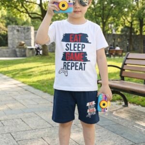 Front view of a boy in TrendWale "Eat Sleep Game Repeat" white t-shirt and matching deep navy shorts.