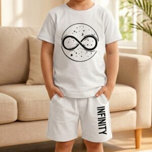 Toddler boy modeling the TrendWale white cotton shorts set featuring "Infinity" vertical text on the leg.