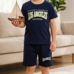 Boy in navy Los Angeles printed cotton t‑shirt and shorts set from TrendWale